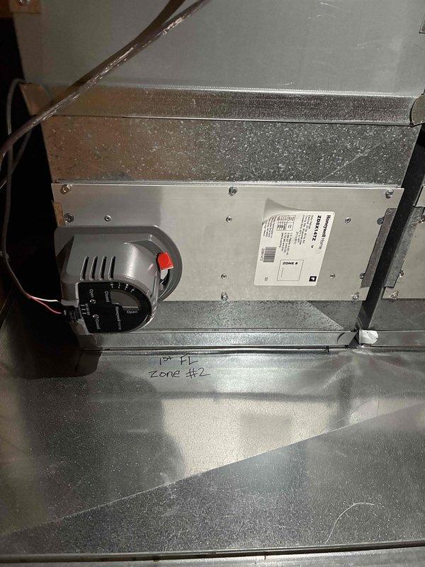 Completed first floor zoning system upgrade with installation of 3 Ecobee smart thermostats, 4 zone dampers (with visible actuator mechanisms for zones #1 and #2), and a zone panel kit. System will provide improved temperature control and efficiency through independent regulation of different areas.