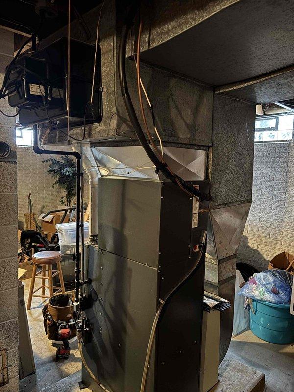 Responded to no heat service call for 10+ year old Goodman furnace system. Diagnosed failed secondary heat exchanger causing unit shutdown. Inspected installation setup in basement including furnace units, ductwork, and venting components. Provided customer with repair and replacement options after comprehensive system evaluation.