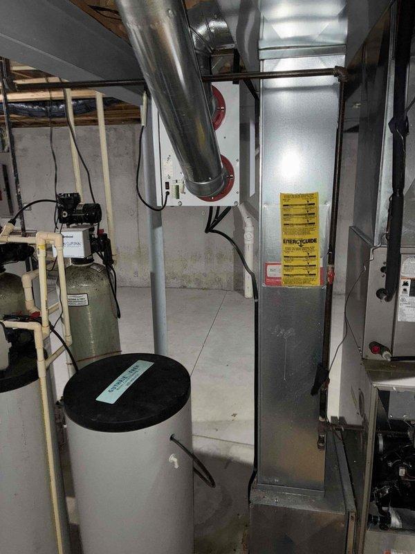 Responded to no heat complaint on aging HVAC system. Inspected furnace heat exchanger and found signs of failure causing system shutdown. Observed snow accumulation on outdoor condensing unit which may contribute to reduced system efficiency. Recommended full replacement of furnace due to age and condition of heat exchanger.