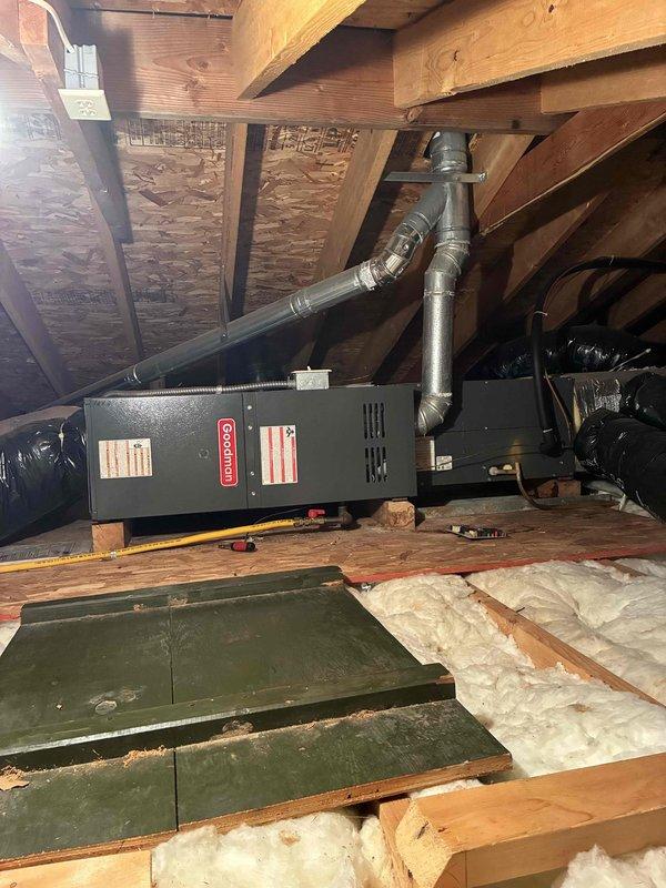 Diagnosed and serviced a Goodman attic furnace mounted horizontally that was non-operational. After inspection of internal components including blower motor assembly, electrical connections, and pressure switch, restored heating functionality. System is aging (10+ years) but now operating within specifications following necessary repairs.
