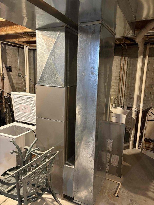 Responded to no heat service call; diagnosed seized blower motor causing burning smell. Presented customer with both repair options for existing furnace and new equipment replacement alternatives.