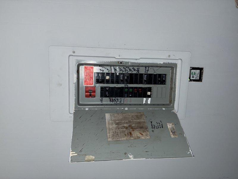 Responded to power loss affecting four first floor outlets located between kitchen and living room. Diagnosed failed circuit breaker that would not reset after customer overloaded circuit by simultaneously running heater and coffee maker. Replaced defective breaker, restoring power to all affected outlets. Recommended future panel upgrade due to observed panel condition; customer acknowledged recommendation and plans to follow up in spring.