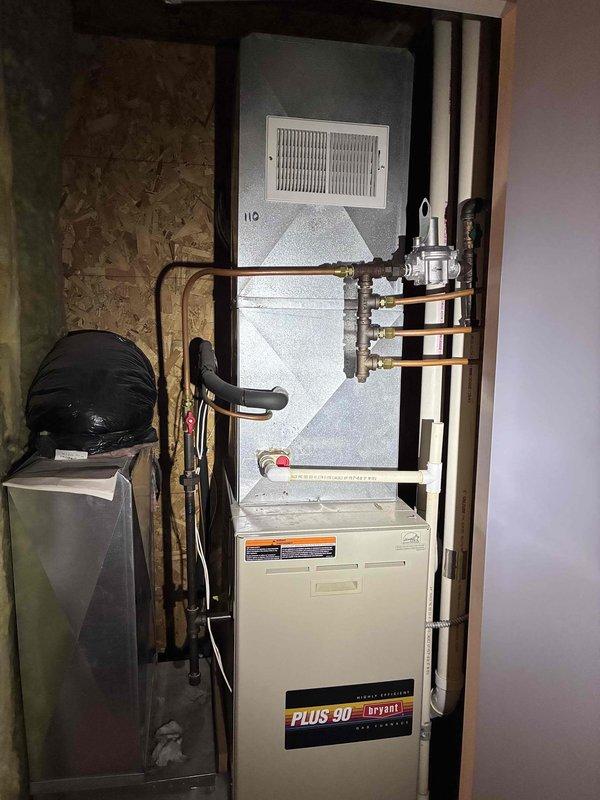 Responded to no heat complaint on a Bryant Plus 90 system (10+ years old). Identified failing heat exchanger as primary cause. Performed maintenance including clearing drain trap, hoses, and pressure switch tubes to restore temporary operation. Provided homeowner with repair versus replacement options due to age of equipment and severity of heat exchanger deterioration.