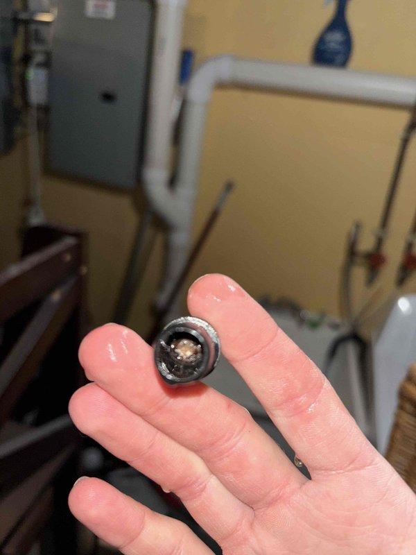 Responded to commercial no-heat service call and diagnosed restricted condensate drainage system. Removed blockage from inducer drain line that was preventing proper furnace operation, as evidenced by mineral buildup and scale deposits. System now functioning normally with proper condensate drainage.