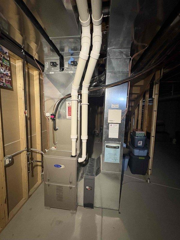 Responded to no heat call for a Carrier furnace system. Diagnosed faulty inducer motor with water accumulation causing system failure. Removed water from inducer motor which restored proper operation. System functioning normally after service.