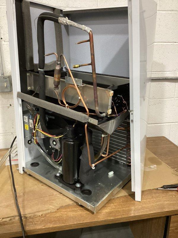 Responded to service call for inoperative HVAC unit (S#: J2096733). Diagnostic inspection revealed refrigerant leak at evaporator coil resulting in complete loss of refrigerant charge. Replaced failed coil assembly and restored proper system operation with factory-specified refrigerant charge.