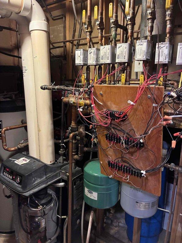 Responded to no heat complaint on Weil-McLain boiler showing error code E02. Diagnosed issue as plugged condensate drain tubing causing water leakage. Cleared obstruction from condensate line and verified proper system operation, restoring heat functionality.