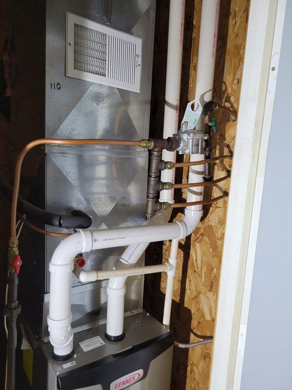 Successfully installed a Lennox EL297E 70K BTU furnace in the attic, with complete installation of PVC condensate drain lines and proper venting. Connected copper gas lines with brass fittings to the unit and installed a safety switch per manufacturer specifications. All connections were properly secured and system was tested for operation.