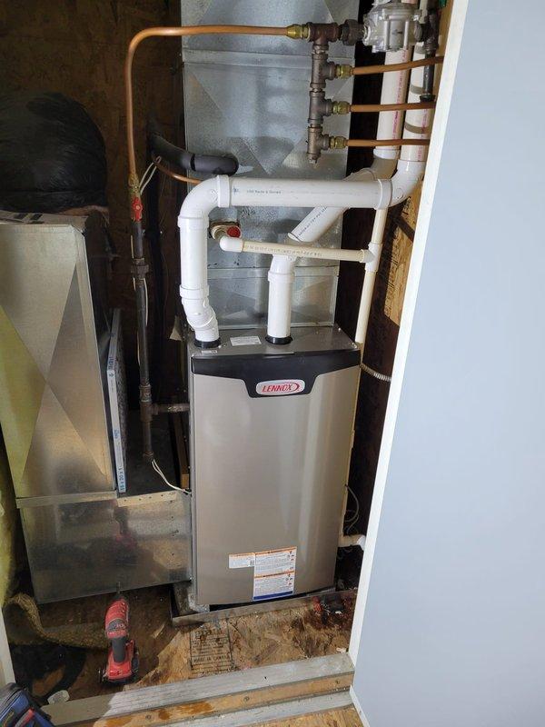 Successfully installed a Lennox EL297E 70K BTU furnace in the attic, with complete installation of PVC condensate drain lines and proper venting. Connected copper gas lines with brass fittings to the unit and installed a safety switch per manufacturer specifications. All connections were properly secured and system was tested for operation.