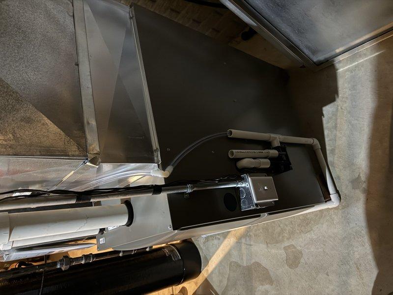 Completed installation of ML196 70K furnace, reusing existing drop, media cabinet, PVC venting (32ft with 5 90-degree elbows), and 40ft refrigeration lines. Connected drainage to floor drain in open ceiling basement. Existing humidifier was left in place per customer preference. All connections properly secured and system tested for operation in 1620 square foot residence.