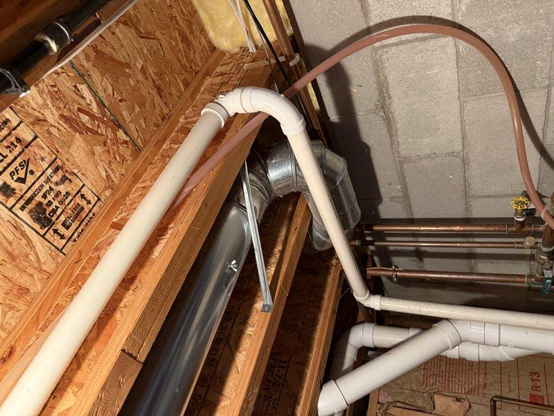 Returned to complete A/C installation with final connections of drain lines and refrigerant piping. Installed PVC condensate drainage system with proper slope and connected copper refrigerant lines to indoor coil. All connections were secured and system was properly commissioned.