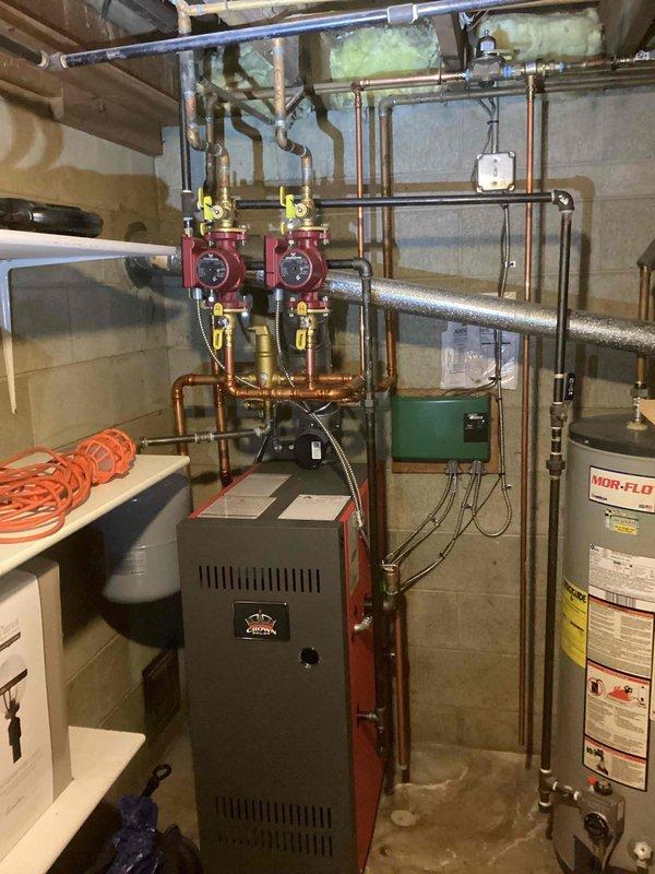 Performed annual maintenance service on Crown boiler system. All components inspected including gas valve assembly, copper piping network, and red circulator pumps. System operating within manufacturer specifications; no issues identified during maintenance procedure.