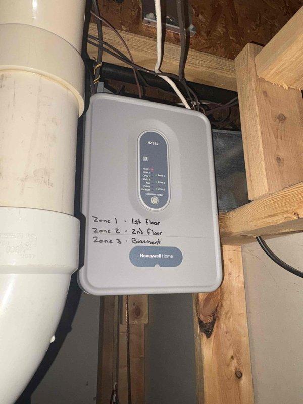 Responded to callback for whole-home humidifier issue. Inspected Aprilaire humidifier unit mounted on HVAC ductwork and evaluated Honeywell Home zoned control system (3 zones: 1st floor, 2nd floor, basement). Resolved connectivity issue between humidifier and control panel by repairing damaged orange signal wire and recalibrating system settings.