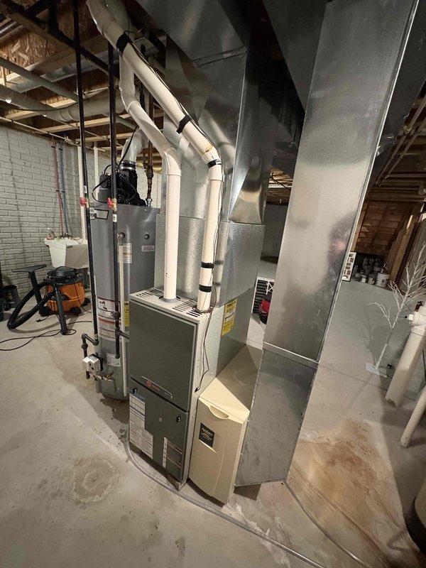 Responded to No Heat call for aging HVAC system located in basement. Conducted thorough inspection of furnace unit with connected PVC exhaust/intake system and metal ductwork. Diagnosed and repaired malfunctioning ignition system, restoring proper heat function to the residence.