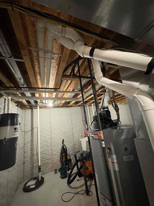 Responded to No Heat call for aging HVAC system located in basement. Conducted thorough inspection of furnace unit with connected PVC exhaust/intake system and metal ductwork. Diagnosed and repaired malfunctioning ignition system, restoring proper heat function to the residence.