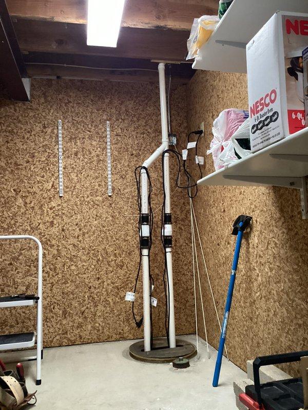 Installed two Jim Murray EC-MAN submersible pumps with remote floats in existing sump crock, adding quiet check valves to both units. Wired a dedicated 15-amp circuit from generator panel to power the new secondary sump pump and upgraded discharge piping to 1½" PVC to ensure proper water flow capacity for the dual pump system.