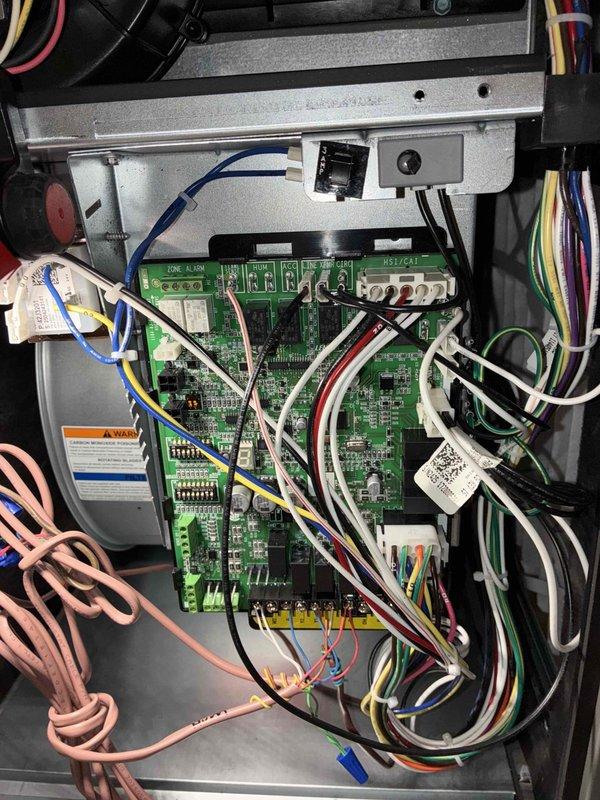 Responded to a call back for humidifier low voltage wiring issues. Upon inspection, determined the humidifier was operating without call for heat and without blower activation. Accessed control board terminals and rewired connections to ensure proper humidifier operation with appropriate blower activation sequence.