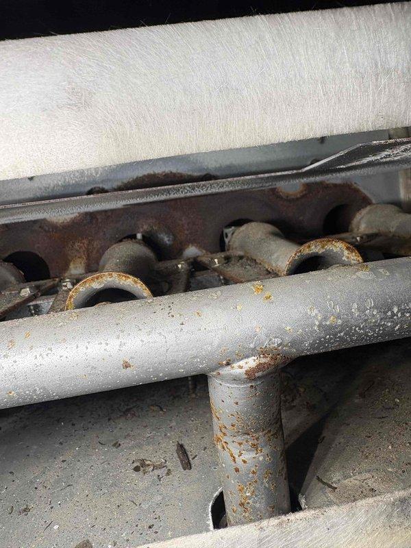 Responded to no heat call for 10-12 year old system. Upon inspection, discovered significant corrosion on heat exchanger components and rusty sections on multiple ports. Identified compromised PVC venting (2 1/2" CRE). System determined to be at end of serviceable life due to extensive oxidation on critical components.