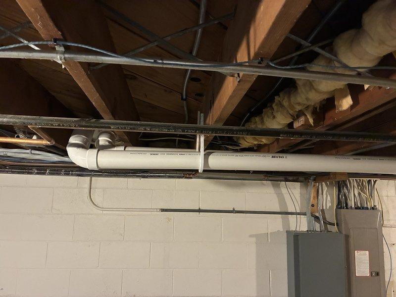 Inspected leaking boiler fitting in basement where copper pipe connection was failing. Identified sagging PVC exhaust line requiring additional support brackets. Explained WiFi connectivity options for the boiler system to customer and demonstrated proper setup procedure.