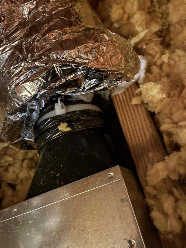 Completed installation of a bathroom ventilation system, which included routing insulated ductwork through the wall cavity and connecting to the exhaust pipe. Ensured proper sealing at connection points with foil tape and verified the system was ready for electrical hookup by the customer's electrician.