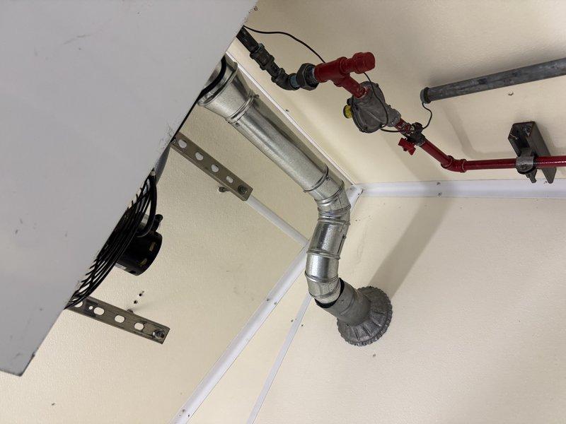 Successfully installed Reznor UDXC45 unit heater, hanging from ceiling in small building. Completed metal ventilation ductwork installation with proper mounting brackets and connected the system to existing gas lines with appropriate valves and pressure gauges. Verified proper system operation with controller functioning and indicator light showing normal operation.