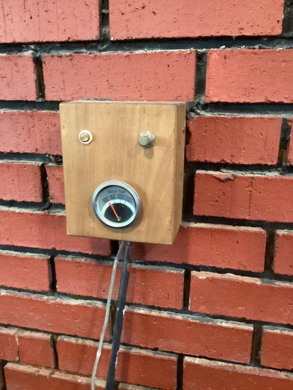 Conducted initial assessment of high-risk system consisting of a 1978 water-jacketed fireplace connected to 30+ year-old boiler. Observed significant gurgling in the hydronic wood stove and documented pressure gauge readings on brick mounting. Inspected expansion tank, valves, and copper piping network showing signs of deterioration. Relief valve repeatedly activating during operation. Advised customer against using the fireplace component and recommended obtaining quote for complete system replacement due to critical safety concerns.