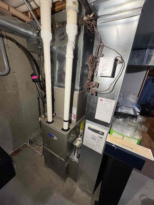 Performed annual maintenance on dual Carrier furnace system according to CCC Quality Plan Agreement. Conducted comprehensive tune-ups on both units, replaced two 16x25x4 air filters, and completed cleaning and operational check of the humidifier system. All equipment functioning properly with no issues identified.