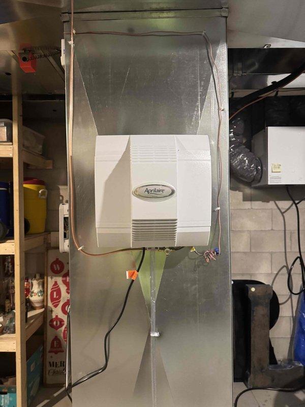 Performed complete annual furnace tune-up on 2006 model, including inspection of heat exchanger, flame sensor, igniter, inducer motor, blower motor, burners, venting, safety limits, and gas operation. Cleaned blower compartment, drain trap, and replaced all drain hoses. System testing confirmed proper operation with readings: inducer amp 0.49, gas pressure 1.7/3.4, blower amps 6.96, HSI ohms 64.7, return temp 73°F, supply temp 121°F, heat rise 48°F, and CO level 19.