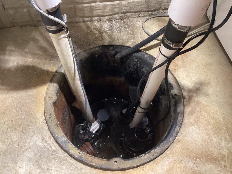 Successfully installed a secondary sump pump system in customer's basement, adding a Jim Murray EC-MAN submersible pump with remote float switch. Ran a dedicated 15-amp circuit from the generator panel to power the new pump installation. Mounted two quiet check valves to complete the water management system, ensuring proper drainage and backup protection.