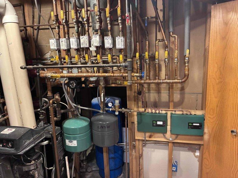 Completed installation of new zone control panels for 7 heating zones and 1 domestic hot water tank. Re-routed and extended wiring to properly position panels on wall behind and to the right of the boiler. Performed necessary rewiring of the older style boiler control system to integrate with new zone panels, ensuring proper functionality of all heating zones and domestic hot water control.