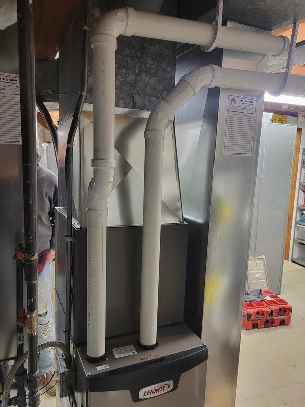 Completed installation of dual HVAC systems consisting of two Lennox EL297V 70K furnaces, two EL15KC1 2-ton condensers, two 18/24B-71 cased coils, and two T6 thermostats across two floors. Work included installing 16x25x1 filter racks on both units, adding new return drops, replacing approximately 4-5ft of venting pipe per run, and replacing old brass gas valves to prevent potential leaks. Existing refrigeration lines were reused, and proper leveling was verified during installation.