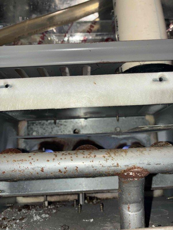 Responded to no-heat call for aging Concord furnace. Inspection revealed significant rust on heat exchanger with visible flame irregularities. Determined heat exchanger has failed, creating potential carbon monoxide hazard. Advised customer that replacement of major components is necessary due to unit's advanced age and safety concerns.