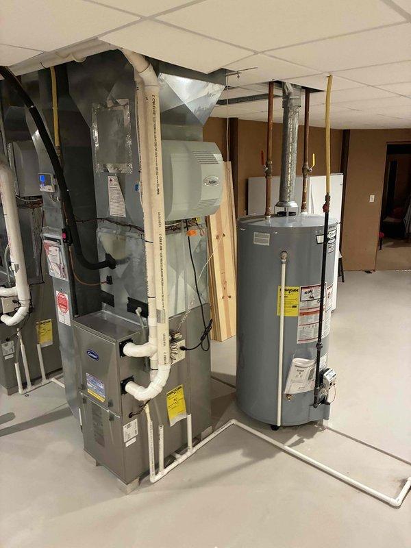 Responded to customer concern regarding small amount of water under furnace. Performed inspection of residential furnace system and connected humidifier in basement mechanical room. Checked operation of furnace, verified proper drainage of condensate, and confirmed all PVC venting and connections were secure and functioning correctly.