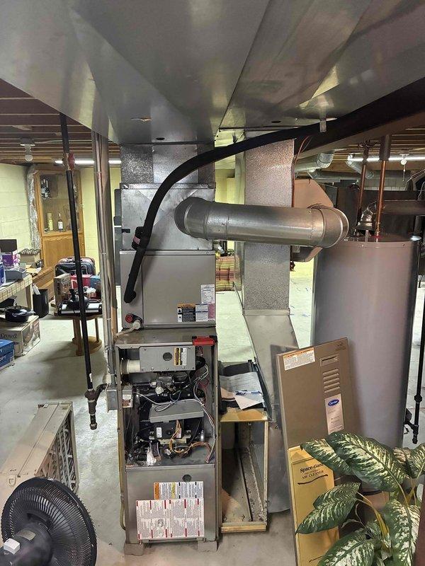 Responded to no heat call for older furnace system. Upon inspection, found failed inducer motor causing system lockout. Replaced inducer assembly, cleaned flame sensor, and checked all safety controls. System now operating properly with strong heat output and normal cycling.