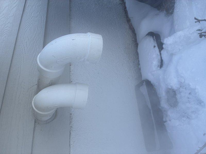 Responded to no-heat complaint on recently installed system. Diagnostic inspection revealed improper installation of exhaust and flue piping, causing combustion gases to be drawn back into the furnace. Documented evidence of excessive snow accumulation around exterior venting. Will return to complete necessary venting modifications to ensure proper system operation and safety.