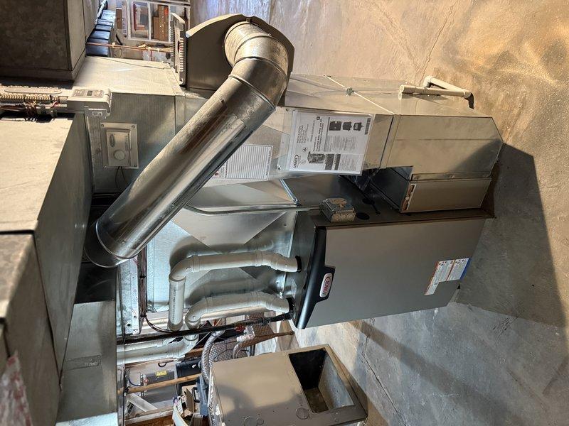 Completed full system installation including Lennox EL297V 90K BTU furnace, EL15KC1 3-ton AC unit, and 30/36C cased coil in open basement. Replaced existing PVC with 12ft 2" cellular core, installed new 40ft line set, and reused existing return drop and media filter cabinet. Replaced all zone dampers and zone board (16x8, 12x8, and 24x8 bottom mount) and connected to Eaton/Cutler Hammer electrical panel with appropriate circuits.