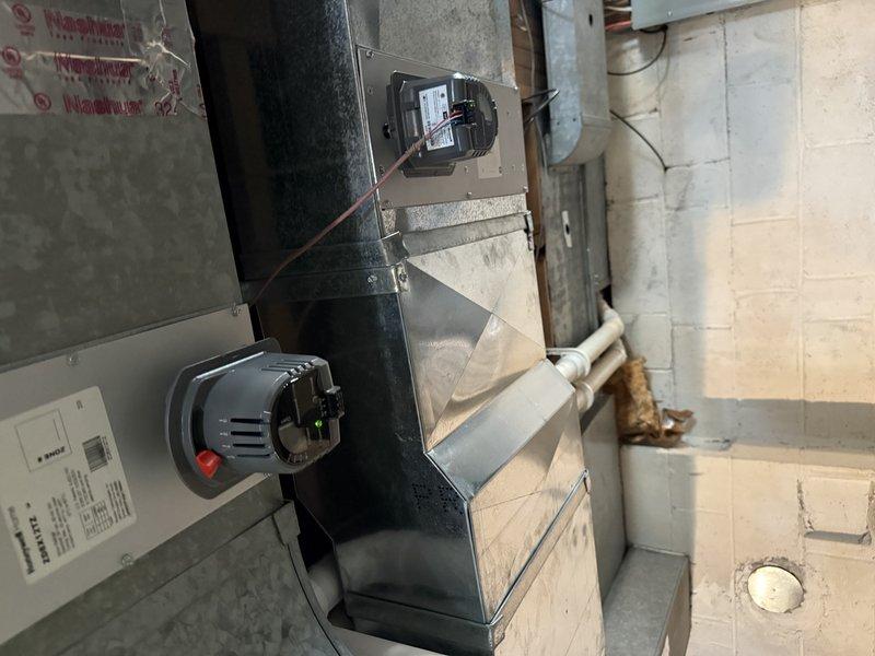 Completed full system installation including Lennox EL297V 90K BTU furnace, EL15KC1 3-ton AC unit, and 30/36C cased coil in open basement. Replaced existing PVC with 12ft 2" cellular core, installed new 40ft line set, and reused existing return drop and media filter cabinet. Replaced all zone dampers and zone board (16x8, 12x8, and 24x8 bottom mount) and connected to Eaton/Cutler Hammer electrical panel with appropriate circuits.