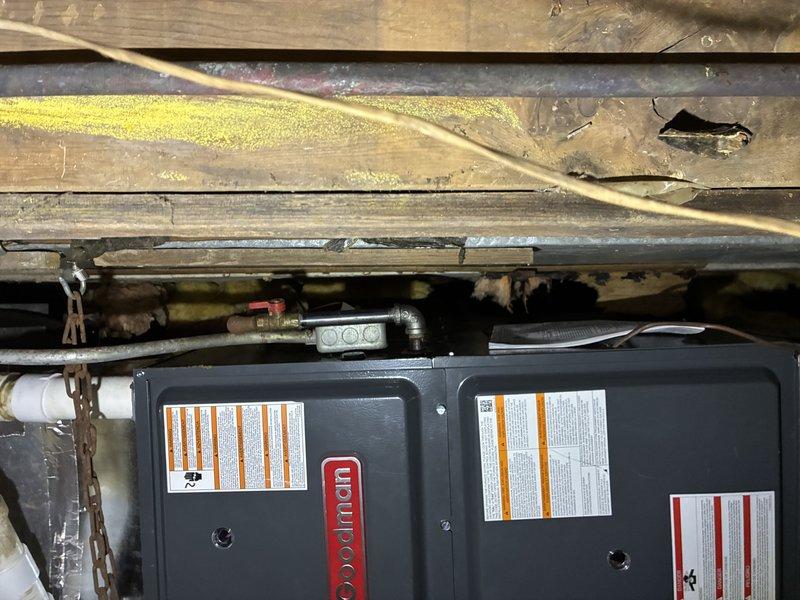 Responded to no heat complaint for Goodman furnace installed by another company in October. Upon inspection in crawlspace with dirt floor, determined furnace was improperly installed. Recommended customer contact original installer for repairs as this installation does not meet proper standards.