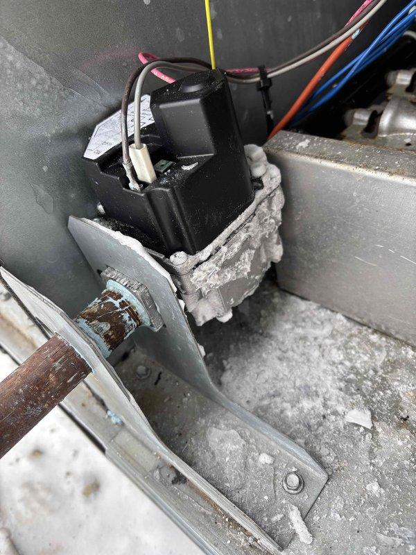 Responded to commercial no heat call, discovered frozen gas line causing system failure. Inspected rooftop HVAC unit and electrical components, diagnosed faulty gas valve. Ordered replacement gas valve to restore heating functionality.