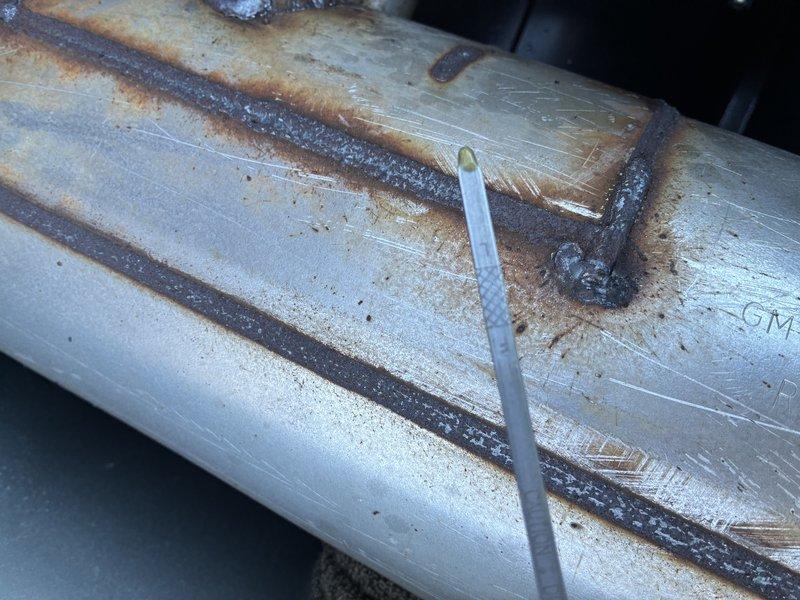 Responded to emergency service call for generator failure. Diagnostic inspection revealed catastrophic engine failure with crankcase fragmentation evident in oil pan. Visual examination confirmed significant internal damage with metal debris present. Warranty claim initiated for complete unit replacement.