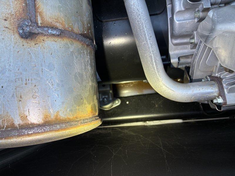 Responded to emergency service call for generator failure. Diagnostic inspection revealed catastrophic engine failure with crankcase fragmentation evident in oil pan. Visual examination confirmed significant internal damage with metal debris present. Warranty claim initiated for complete unit replacement.