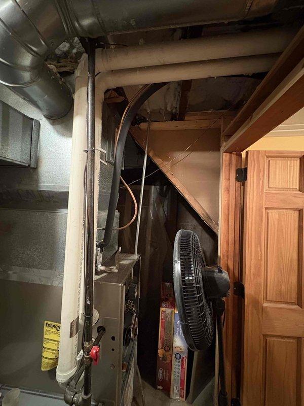 Responded to no heat call for aging back furnace system that was blowing air but not producing heat. Upon inspection in the utility area, observed the furnace and associated ductwork in an unfinished basement setting. Identified issue with PVC exhaust components and restored system to proper heating operation.
