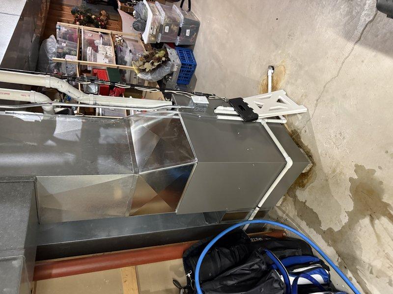 Successfully installed Lennox EL297E 90K BTU furnace in basement utility room, reusing existing 2.5" solid core PVC venting. Completed installation of new 16x25x4 media filter box and connected to existing gas line and drain, with all systems tested and functioning properly.