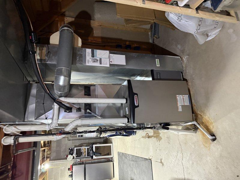 Successfully installed Lennox EL297E 90K BTU furnace in basement utility room, reusing existing 2.5" solid core PVC venting. Completed installation of new 16x25x4 media filter box and connected to existing gas line and drain, with all systems tested and functioning properly.