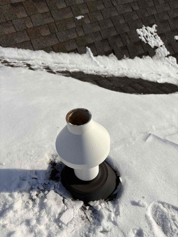 Responded to no heat call for aging system (10+ years). Diagnosed frozen flue vent on roof as the source of malfunction. Successfully thawed accumulated ice from ventilation components, restoring proper exhaust flow and returning heating system to normal operation.