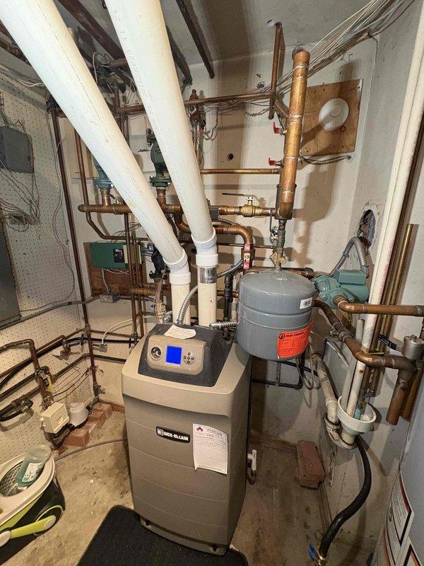 Diagnosed no heat issue on west side of home; discovered failed circulator pump on the hydronic heating system. Replaced defective pump, purged air from system, and verified proper operation of the boiler and circulation to all zones. System now functioning correctly with heat reaching all areas of the residence.