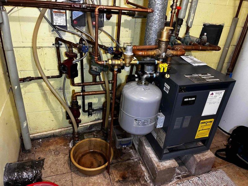 Diagnosed and corrected no-heat condition affecting second floor zone due to failed boiler circulator pump and malfunctioning flow check valve. Replaced circulator pump and rebuilt flow check valve to restore proper hydronic circulation throughout system, successfully resolving heating issues in back rooms and second floor.