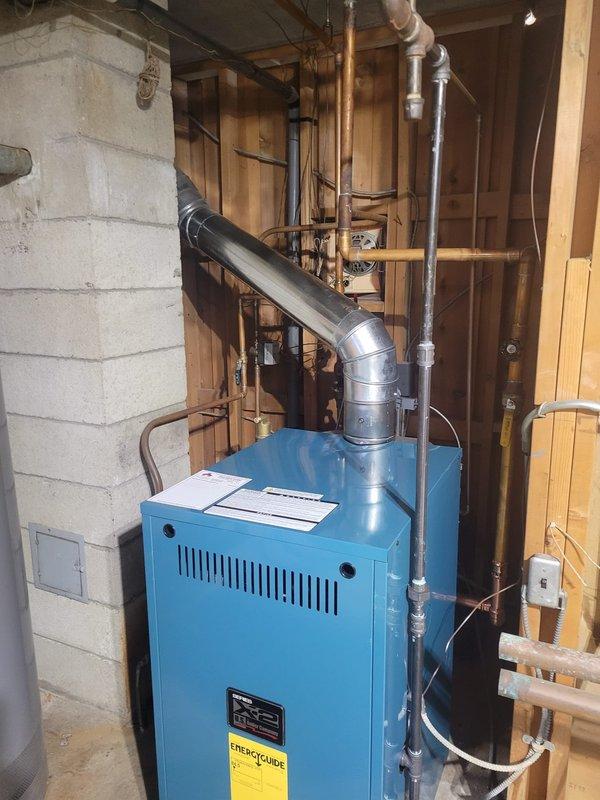 Completed installation of new X2 boiler system to replace failed existing unit. Installed complete vent pipe system with proper elbow joints and connected all required copper plumbing lines. System was tested and confirmed operational with all connections secure.