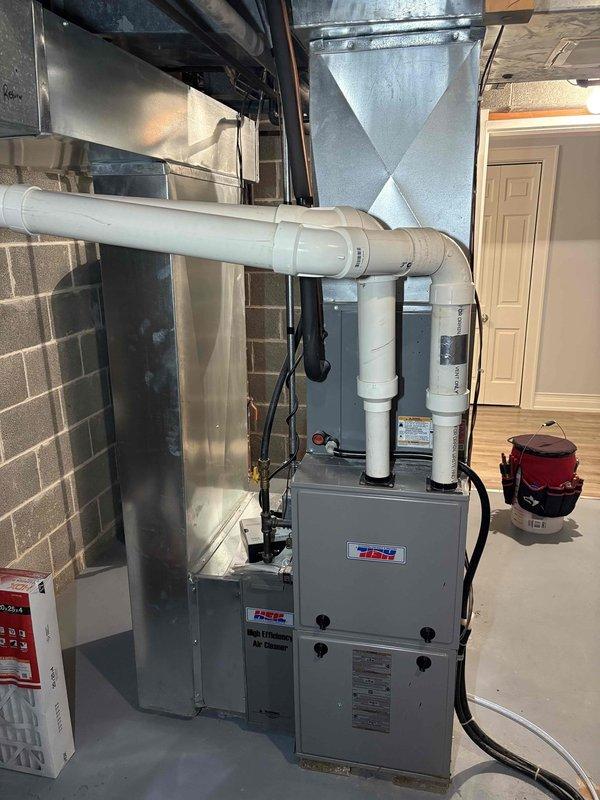 Responded to no-heat service call at vacant property with Heil furnace system over 10 years old. Accessed home via garage code, diagnosed failed ignition sequence and replaced faulty flame sensor. Also identified and repaired leaking AprilAire humidifier that had been previously shut off by cleaning staff. System now operating normally with proper heat output; verified functionality through the Ecobee thermostat.