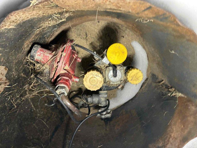 Responded to after-hours no heat service call for system less than 10 years old. Upon inspection, identified gas valve issues at the underground manifold. Cleared debris and cobwebs from Sherwood valve assembly, restored proper gas flow to unit, and verified normal heating operation before departure.